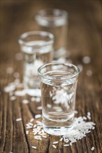 Japanese Sake drink on an old wooden table (close-up shot)