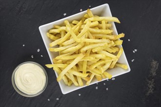 Portion of fresh made crispy French Fries (selective focus, close-up shot)