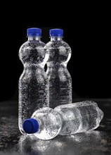 Bottles of chilled sparkling water as detailed close up shot