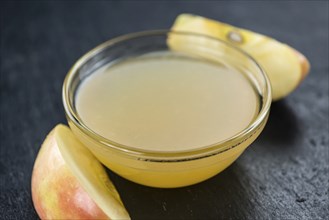 Portion of Applesauce (selective focus) on vintage background (close-up shot)