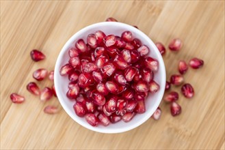 Pomegranate on a vintage background as detailed close-up shot (selective focus)