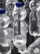 Chilled bottled sparkling water (detailed close up shot, selective focus)