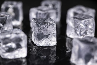 Ice Cubes on dark background as detailed close-up shot, selective focus