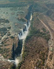 Victoria Falls in Zimbabwe at drought, aerial shot made from a helicopter