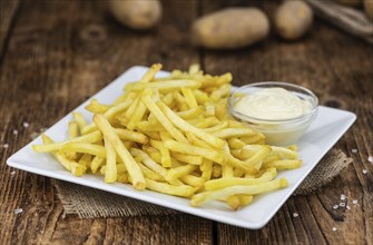 Portion of fresh made crispy French Fries (selective focus, close-up shot)