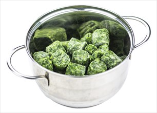 Portion of frozen spinach isolated on white background (close-up shot)