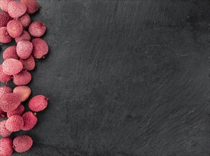 Lychees on a vintage background as detailed close-up shot (selective focus)