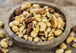 Roasted and salted nuts as detailed close up shot (selective focus)