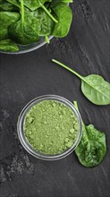 Homemade green spinach powder (close up shot, selective focus)