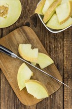 Honeydew Melon on a vintage background as detailed close-up shot (selective focus)