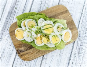 Portion of boiled Eggs (detailed close-up shot, selective focus)