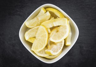 Some Lemon Slices on a vintage slate slab (selective focus)