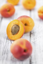 Apricots on a vintage background as detailed close-up shot (selective focus)