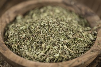 Heap of dried Stevia leaves (sweetener) on vintage background (close-up shot)