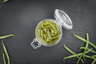 Portion of preserved Green Beans as detailed close-up shot (selective focus)