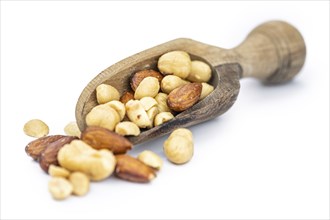 Fresh roasted nuts isolated on white background as close up shot (selective focus)