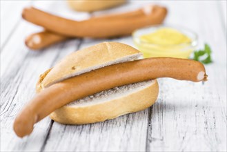 German Sausages (Wiener) as high detailed close-up shot on a vintage wooden table (selective focus)