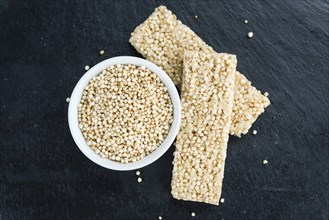 Some fresh made Quinoa Bars on vintage background (close-up shot)