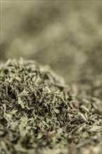 Stevia leaves (dried) for use as background image or as texture (close-up shot, selective focus)