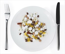 Drugs prepared as meal (close-up shot, selective focus) isolated on white background