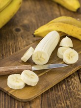 Sliced Bananas on a vintage background as detailed close-up shot, selective focus