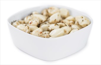 Portion of Preserved Garlic (as close-up shot) isolated on white background