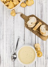 Portion of fresh Chanterelle Soup close-up shot, selective focus