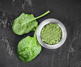 Homemade green spinach powder (close up shot, selective focus)