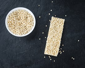 Some Quinoa Bars on a slate slab (close-up shot, selective focus)