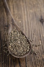 Dried Valerian roots (detailed close-up shot) on wooden background