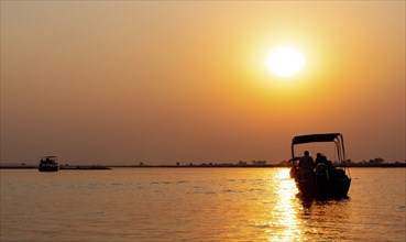 Boat Safari in the Chobe National Park, Botswana with a dramatic sky