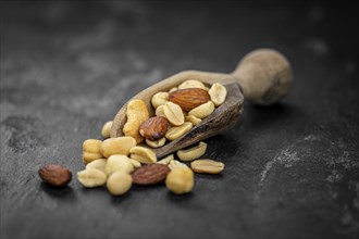 Roasted and salted nuts as detailed close up shot (selective focus)