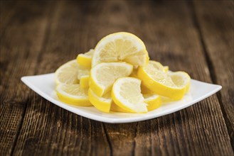 Lemon Slices on a vintage background as detailed close-up shot (selective focus)