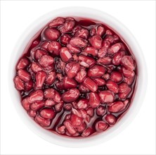 Preserved Pomegranate seeds as detailed close-up shot isolated on white background (selective