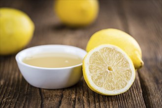 Fresh made Juice (lemon) on a vintage background (close-up shot)