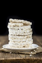 Some Rice Cakes on an old wooden background (detailed close-up shot)