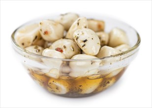 Portion of Preserved Garlic (as close-up shot) isolated on white background