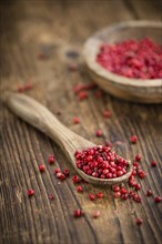 Portion of fresh Pink Peppercorns close-up shot, selective focus