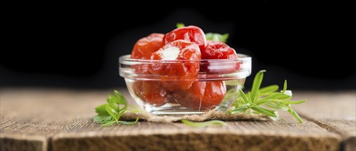 Homemade Filled Pimientos on vintage background (selective focus, close-up shot)