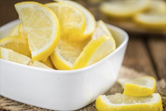 Lemon Slices on a vintage background as detailed close-up shot (selective focus)