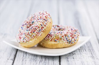 Portion of some Donuts as detailed close-up shot (fresh made, selective focus)