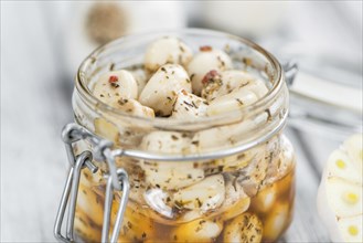 Portion of fresh Preserved Garlic (close-up shot, selective focus)