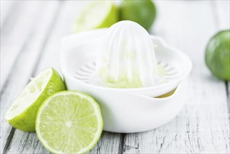 Portion of fresh Lime Juice (close-up shot, selective focus)