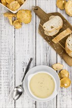 Portion of fresh Chanterelle Soup close-up shot, selective focus