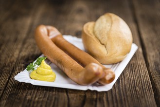 Fresh made German Sausages (Wiener) on a vintage background (close-up shot)