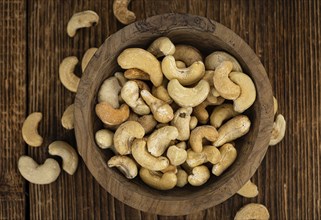 Portion of roasted Cashew Nuts (close up shot, selective focus)