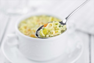 Portion of fresh made Alphabet Soup (selective focus, close-up shot)