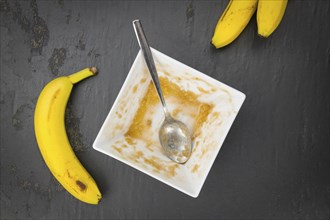 Banana Puree on a slate slab (close-up shot, selective focus)