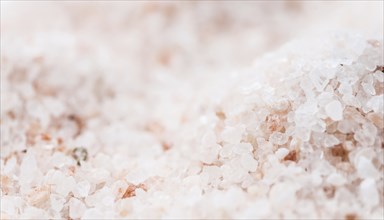 Pink Salt on a vintage background as detailed close-up shot (selective focus)