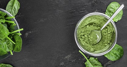 Homemade green spinach powder (close up shot, selective focus)